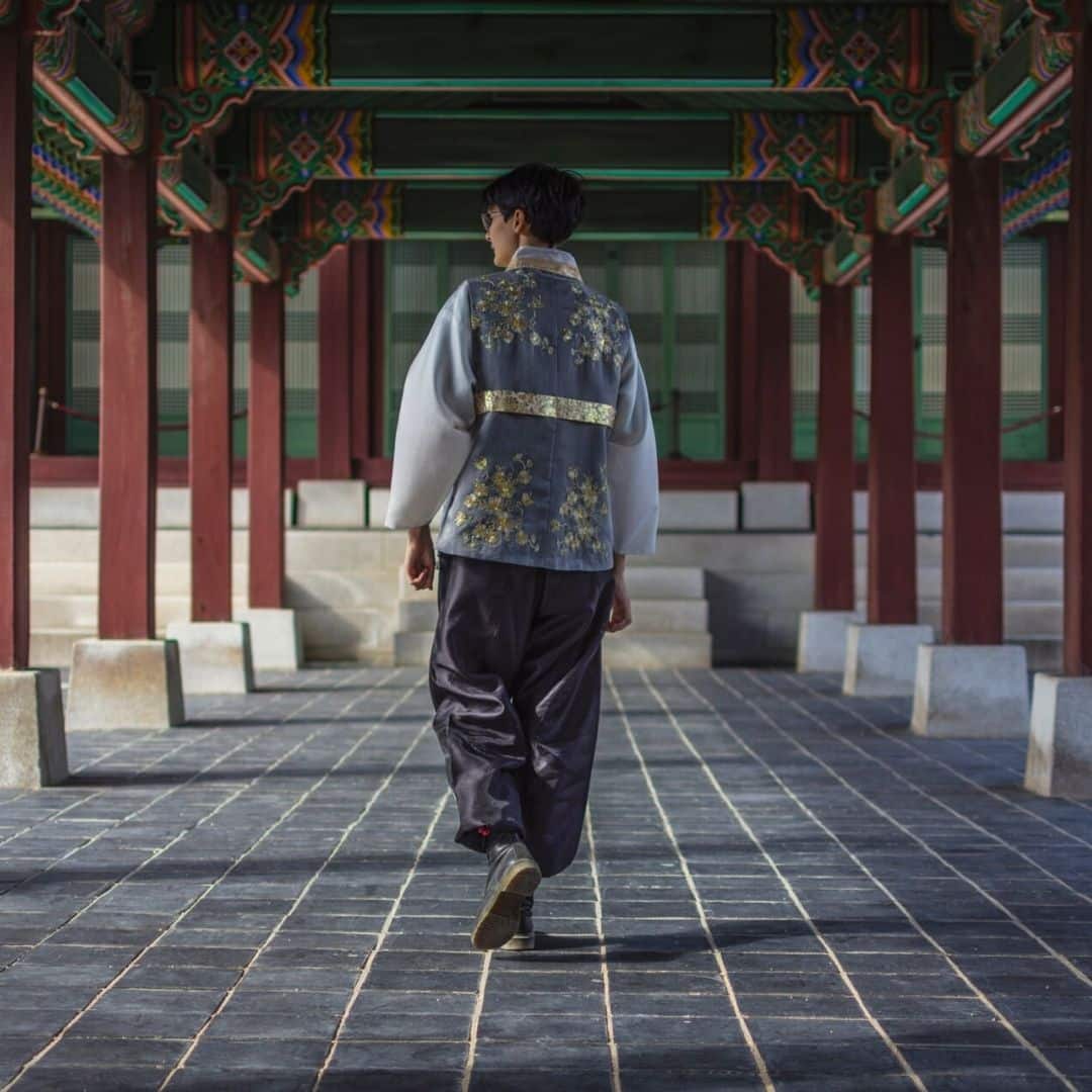 Man in Korean hanbok walking in a palace in Seoul